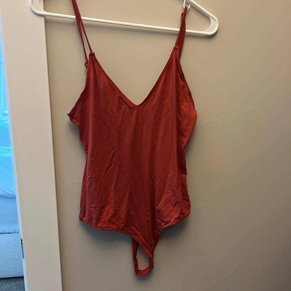 New Rust color tank top bodysuit. Never worn medium.